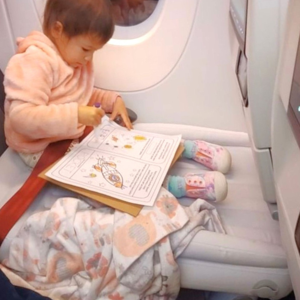 Child Sitting on Flyaway Kids Bed