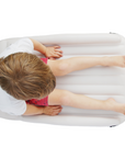Child sitting on top of Flyaway Kids Bed view from the top