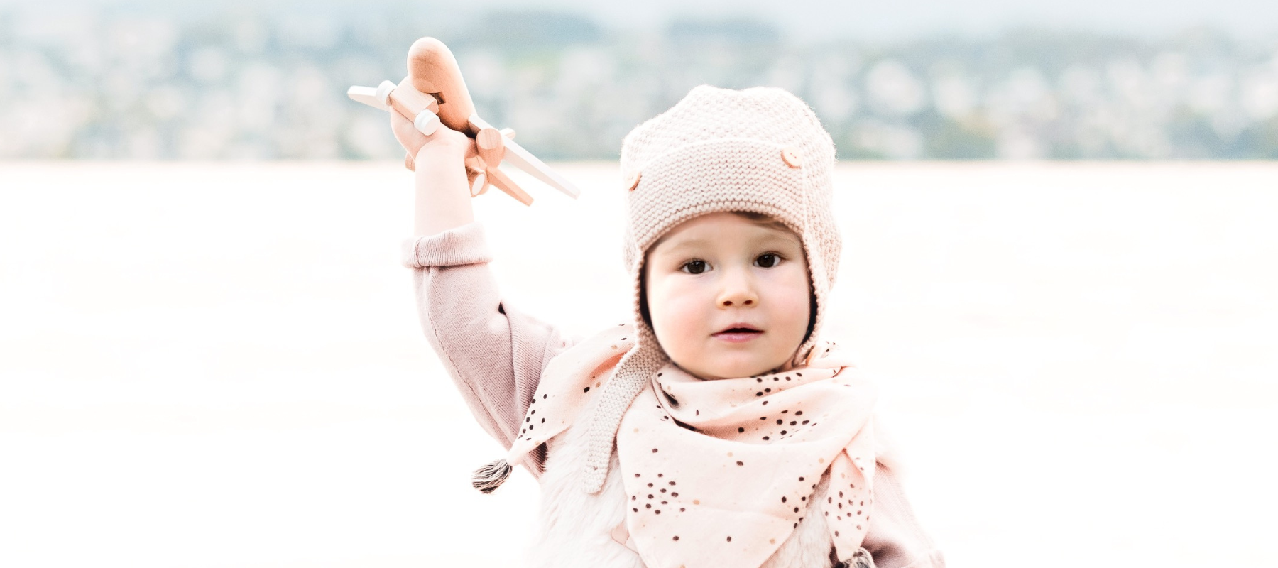 child holding plane
